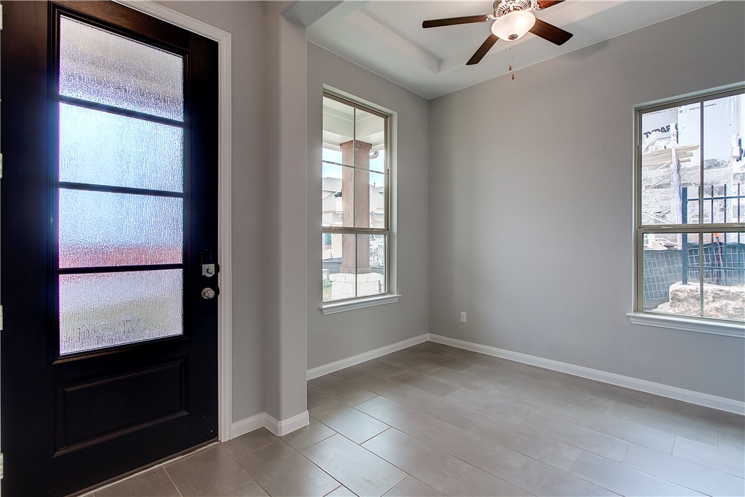 107 Cartwheel Bend Austin, TX 78738 - Photo 4 of 16 Entryway with baseboards and ceiling fan
