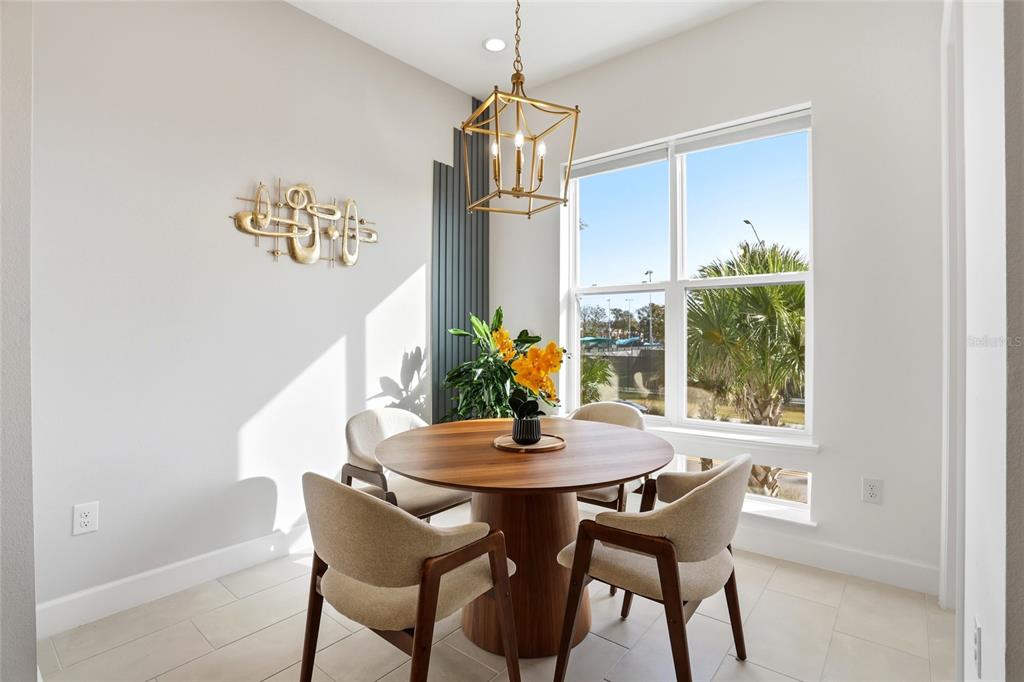 2038 Packing District Way Orlando, FL 32804 - Photo 14 of 39 a dining room with furniture and window
