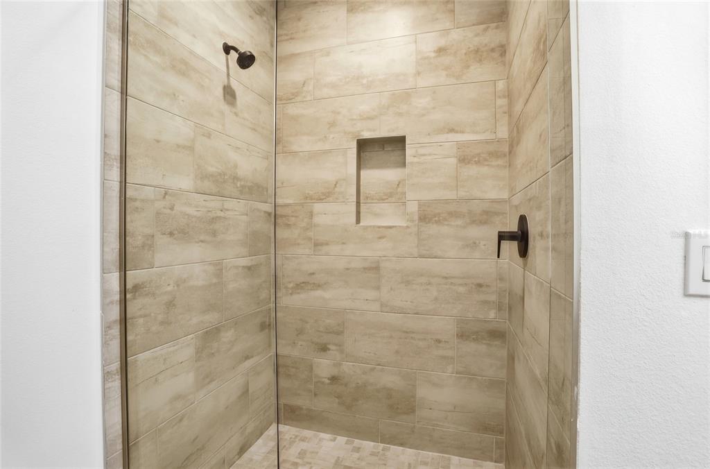 2038 Packing District Way Orlando, FL 32804 - Photo 22 of 39 a bathroom with a shower