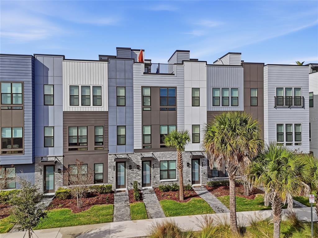2038 Packing District Way Orlando, FL 32804 - Photo 6 of 39 front view of a building with a garden