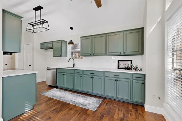 a spacious bathroom with a sink and a mirror