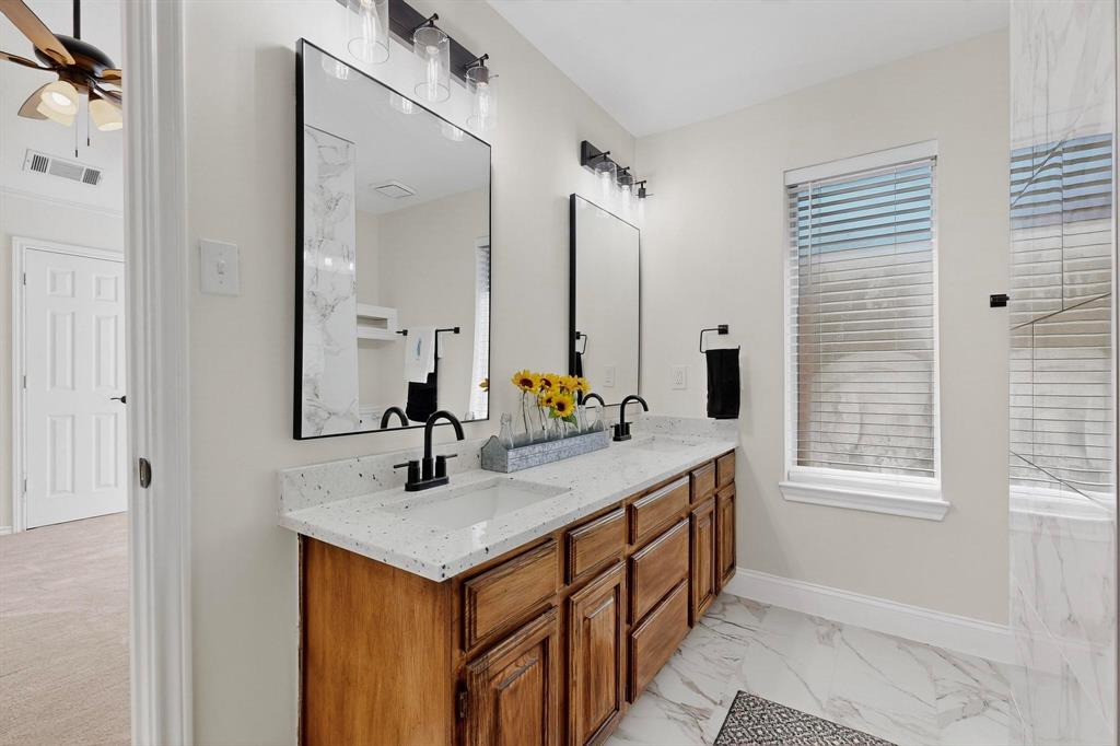 2601 Daisy Lane Rowlett, TX 75089 - Photo 22 of 36 a bathroom with a sink and a mirror