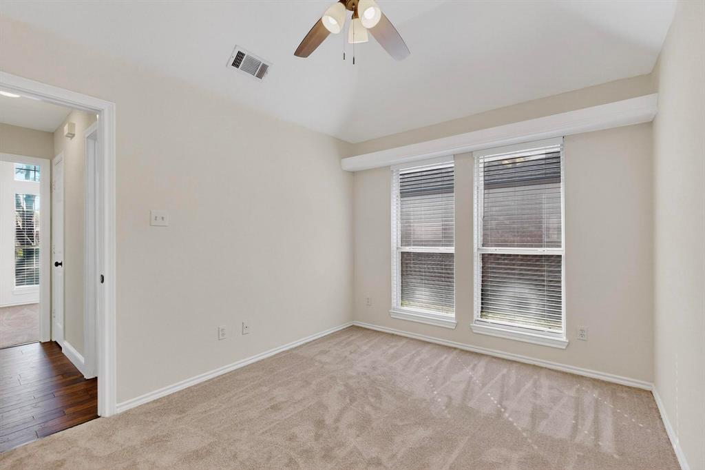 2601 Daisy Lane Rowlett, TX 75089 - Photo 30 of 37 a view of an empty room with a window and wooden floor