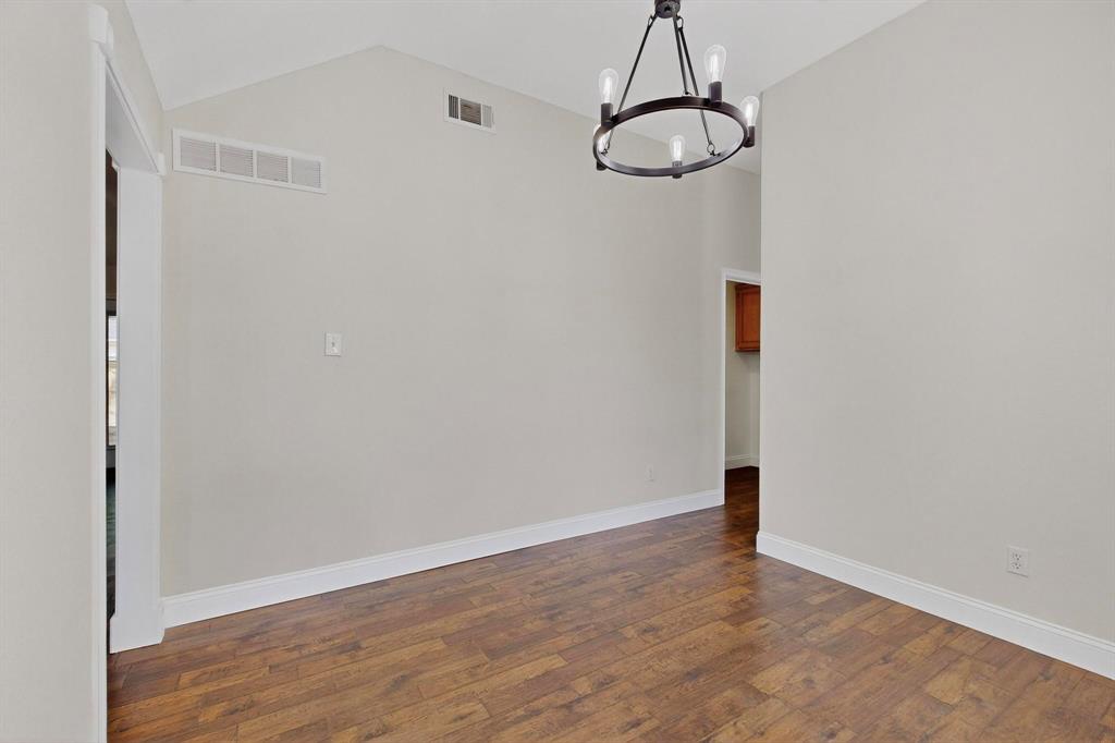 2601 Daisy Lane Rowlett, TX 75089 - Photo 10 of 37 a view of a room with wooden floor and white walls