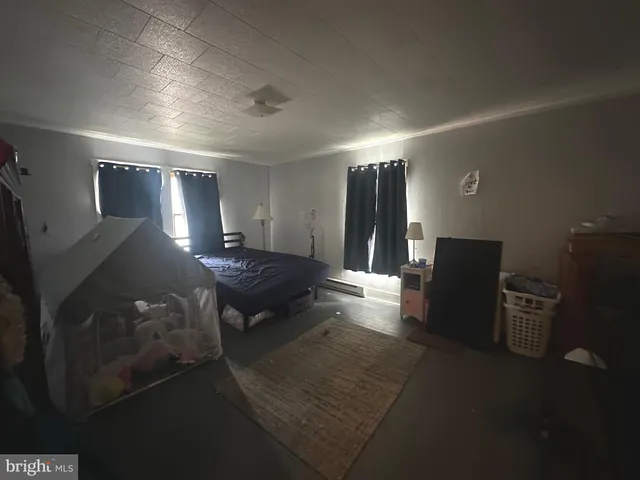 a lobby with furniture and a rug