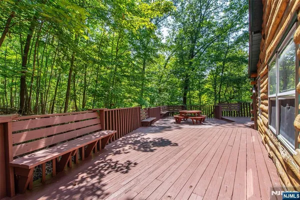 a view of deck with wooden floor and outdoor seating