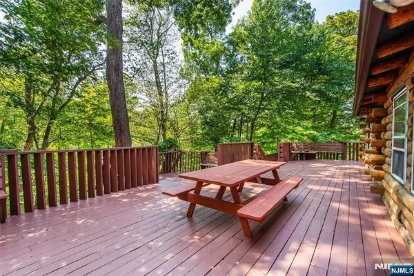 a view of a wooden floor with a bench on the deck