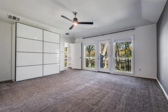 an empty room with a empty space and windows