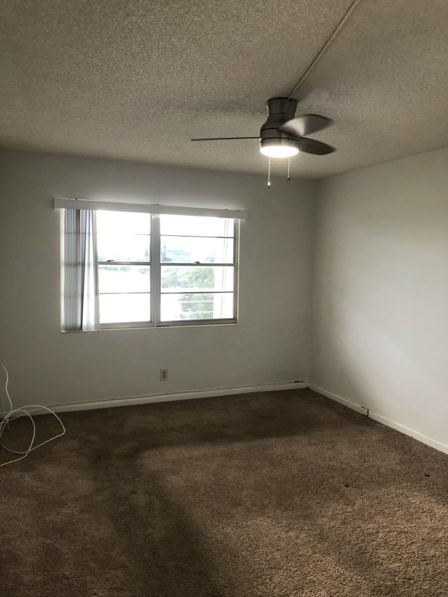 3085 Cornwall East Boca Raton, FL 33434 - Photo 6 of 12 an empty room with a window