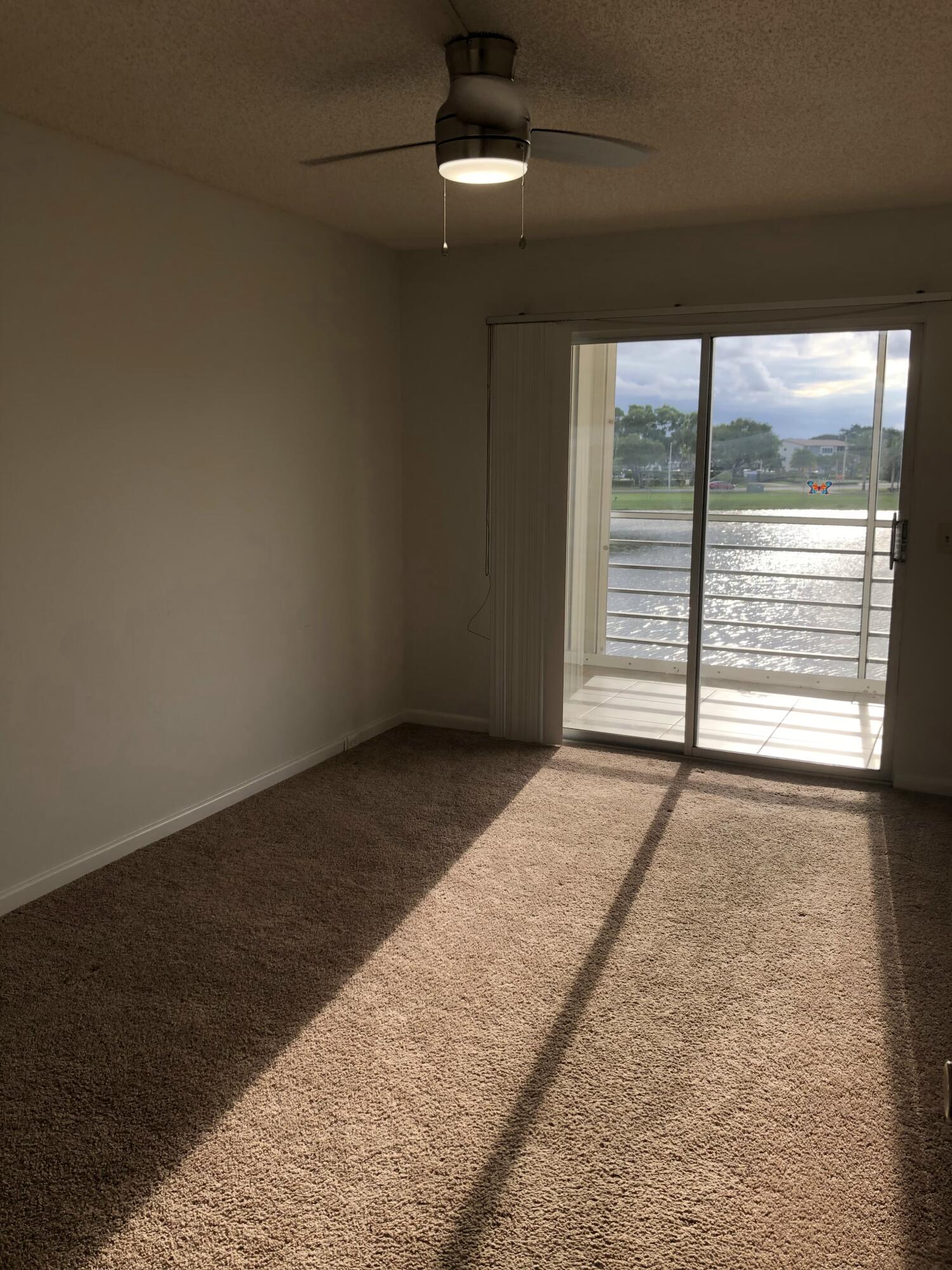 3085 Cornwall East Boca Raton, FL 33434 - Photo 7 of 12 a view of an empty room with a window