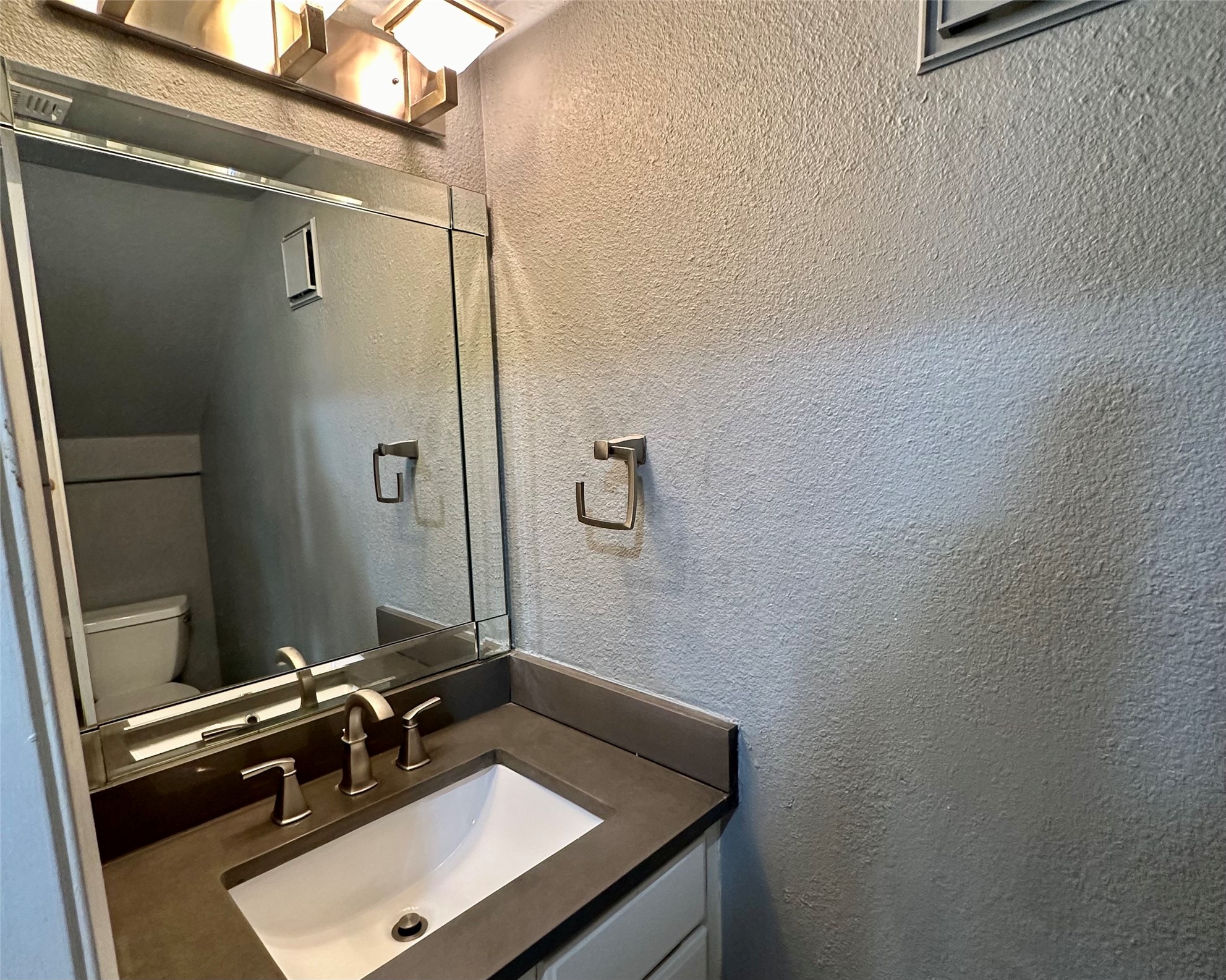 2018 West Rundberg Lane, Unit 5B Austin, TX 78758 - Photo 11 of 23 Downstairs half bath