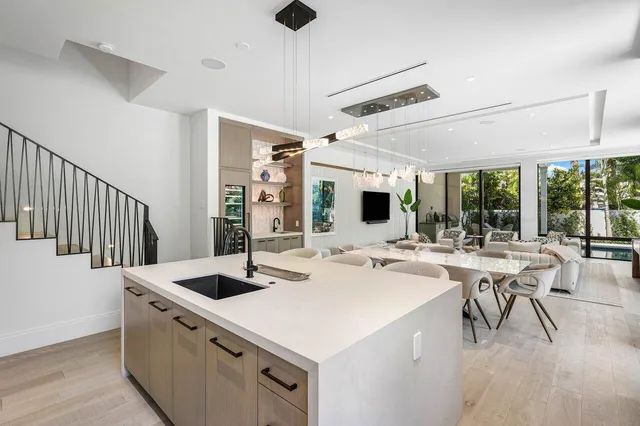 a kitchen with a stove a table and chairs
