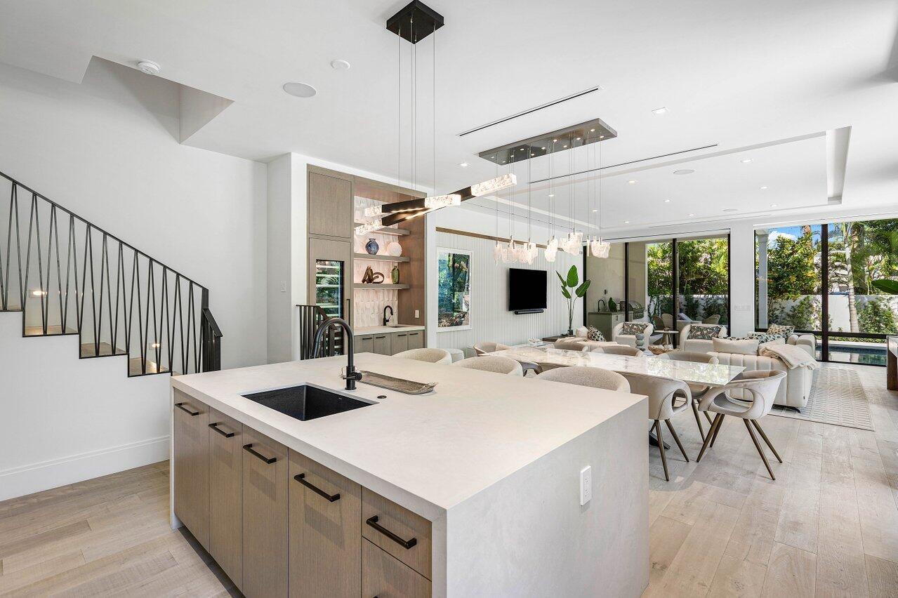 514 Northeast 7th Avenue Delray Beach, FL 33483 - Photo 14 of 51 a kitchen with a stove a table and chairs