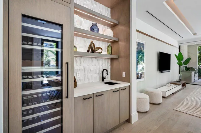 a view of living room kitchen and flat screen tv