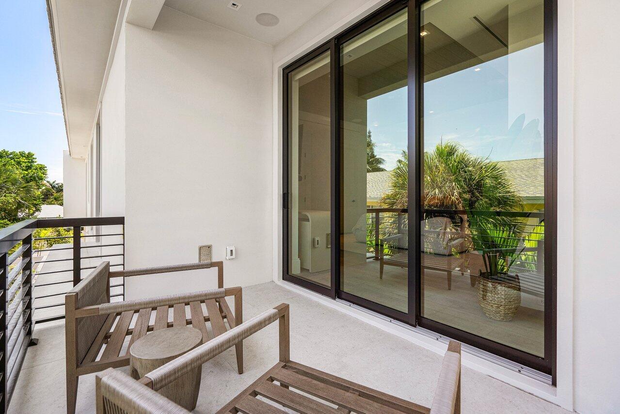 514 Northeast 7th Avenue Delray Beach, FL 33483 - Photo 29 of 51 a view of a balcony with chairs
