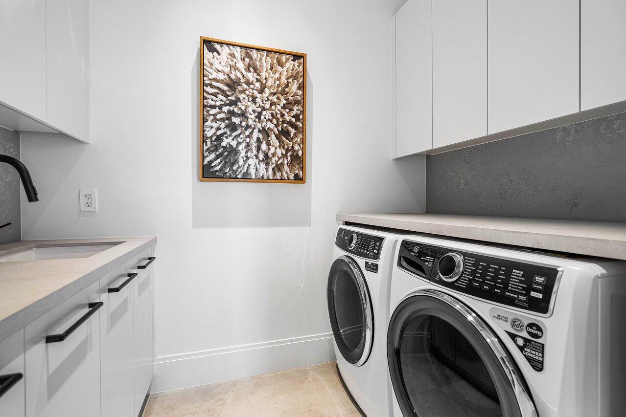 514 Northeast 7th Avenue Delray Beach, FL 33483 - Photo 42 of 51 a utility room with dryer and washer