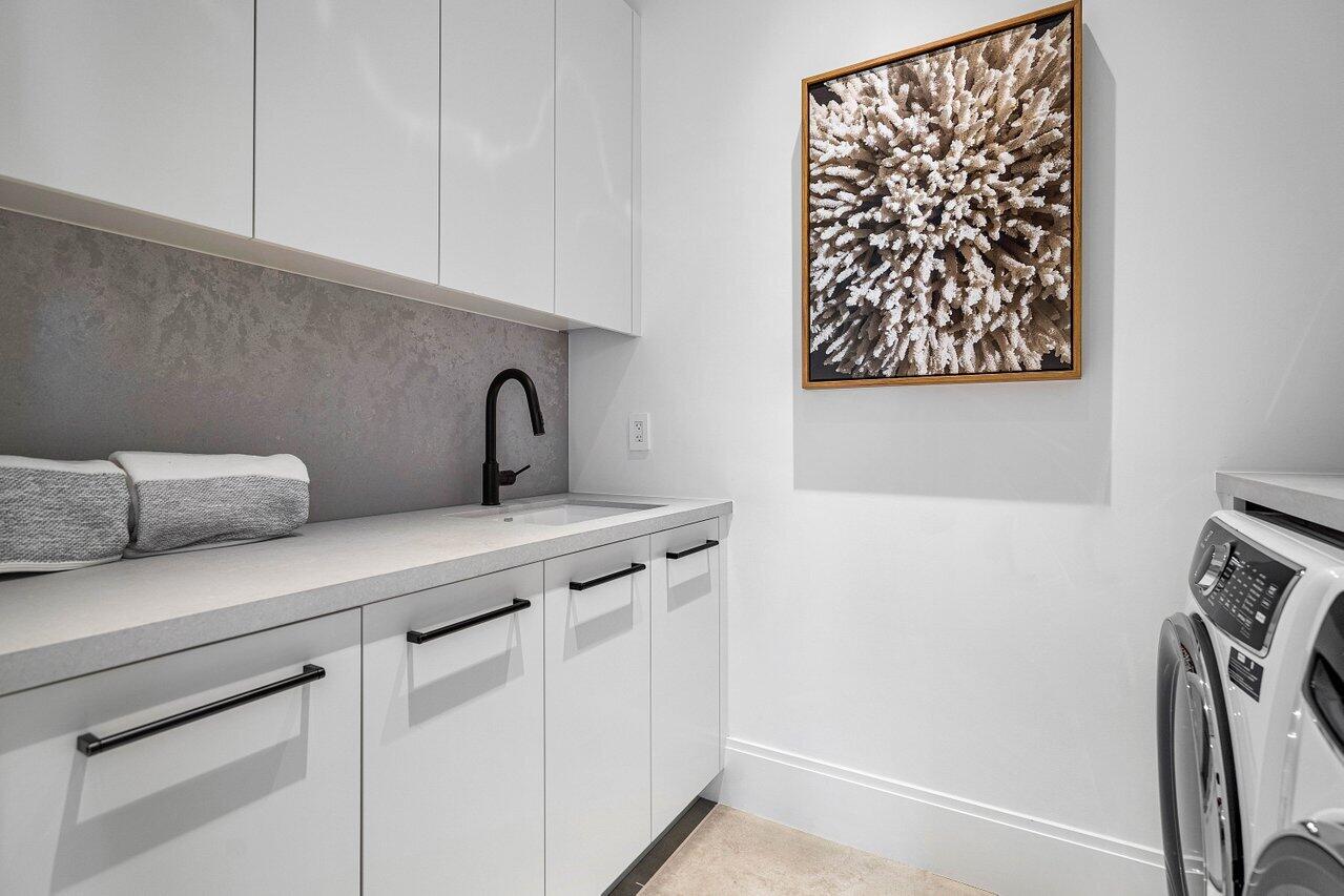 514 Northeast 7th Avenue Delray Beach, FL 33483 - Photo 43 of 51 a kitchen with a sink and cabinets