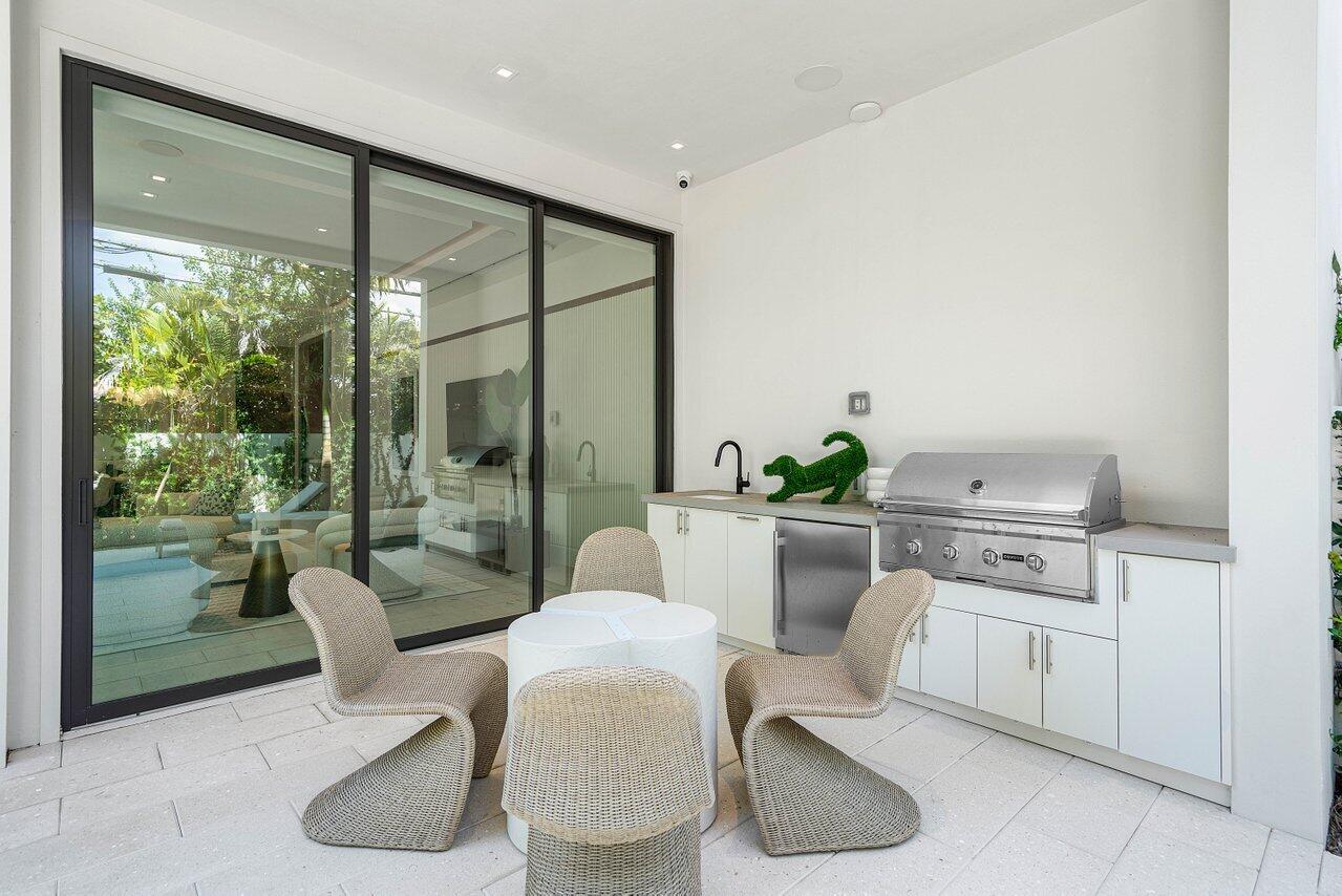 514 Northeast 7th Avenue Delray Beach, FL 33483 - Photo 46 of 51 a living room with furniture a rug and a large window