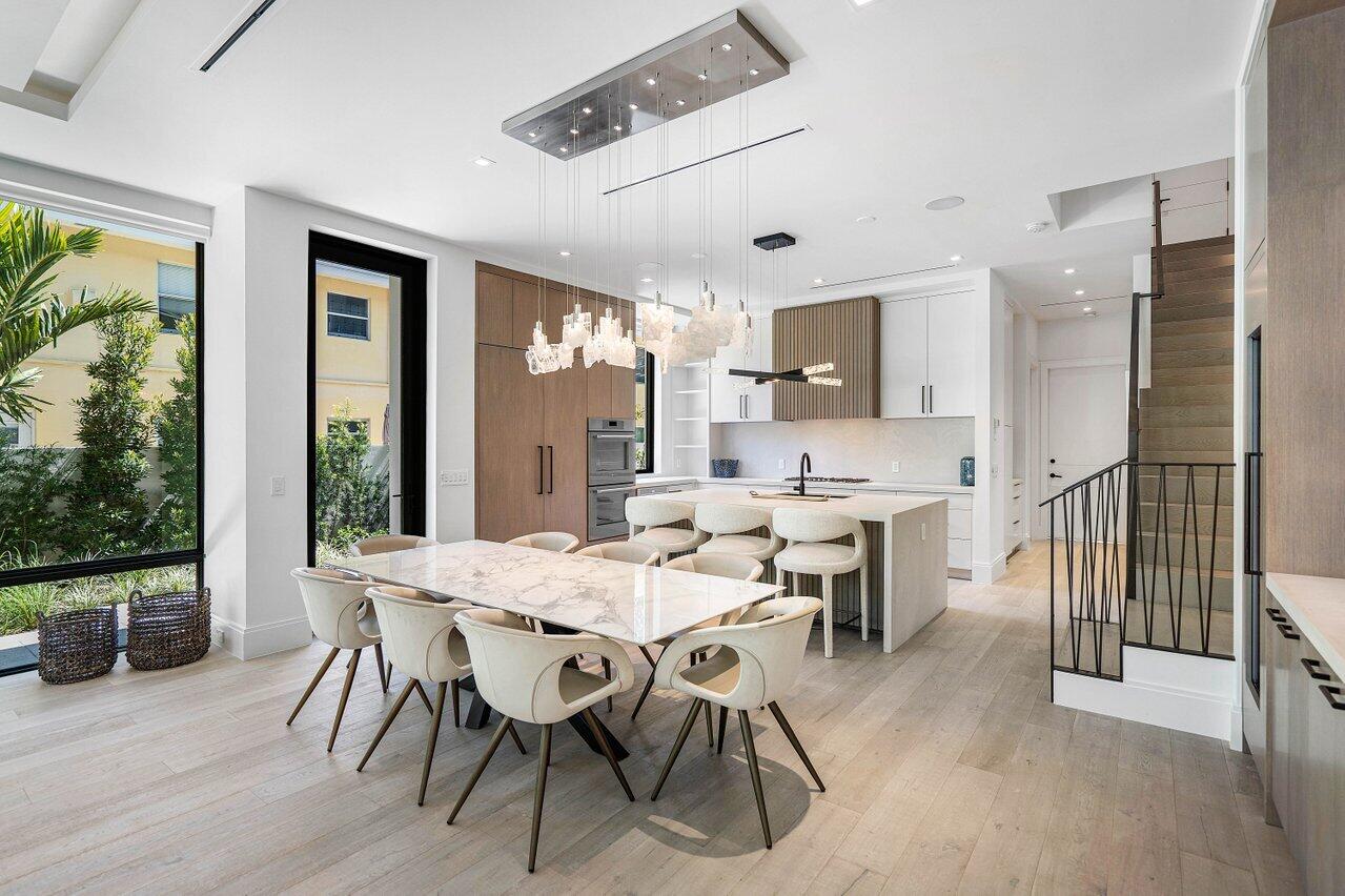 514 Northeast 7th Avenue Delray Beach, FL 33483 - Photo 8 of 51 a view of a dining room with furniture window and wooden floor