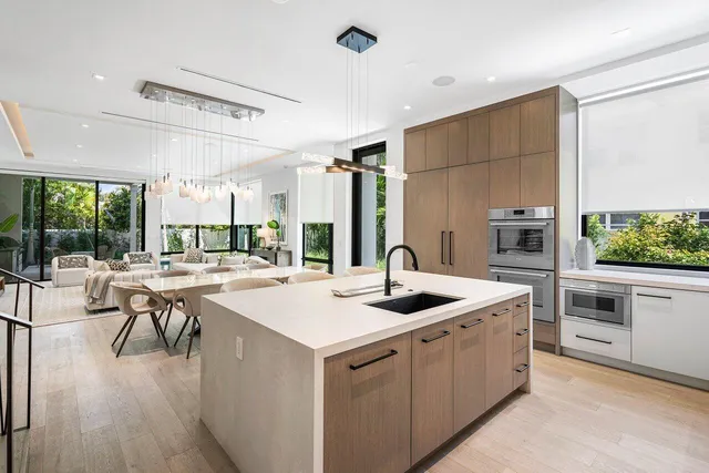 a kitchen with a stove a sink and a refrigerator