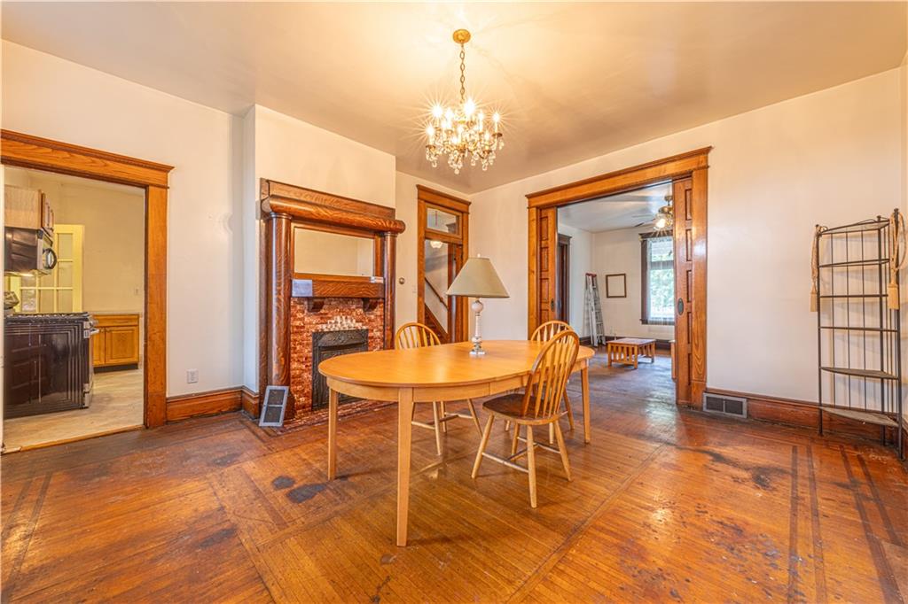 114 Union Street Uniontown, PA 15401 - Photo 20 of 28 a view of a dining room with furniture window and wooden floor