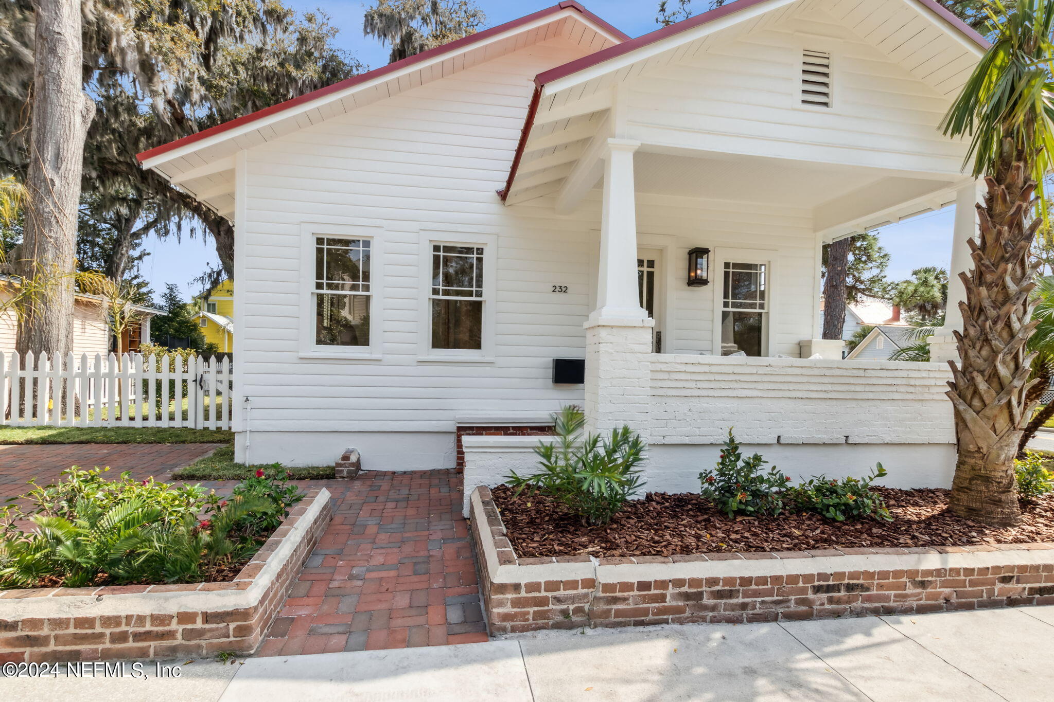 232 South 7th Street Fernandina Beach, FL 32034 - Photo 1 of 43 a front view of a house with a yard