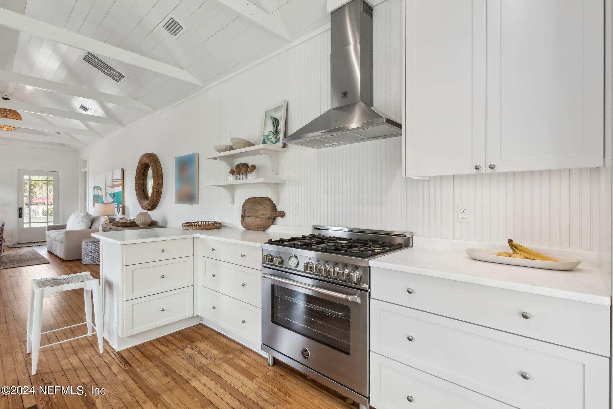 232 South 7th Street Fernandina Beach, FL 32034 - Photo 13 of 43 a kitchen with cabinets and wooden floor