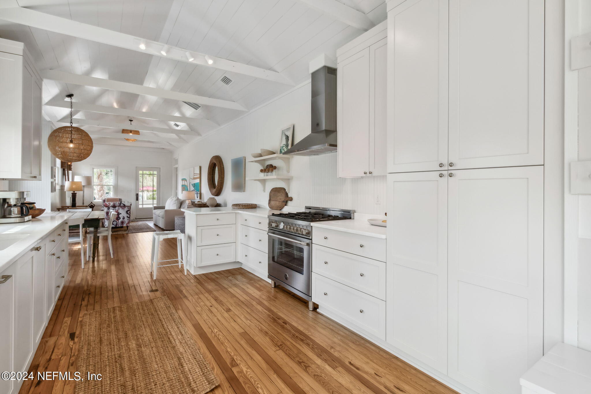232 South 7th Street Fernandina Beach, FL 32034 - Photo 14 of 43 a kitchen with white cabinets and appliances