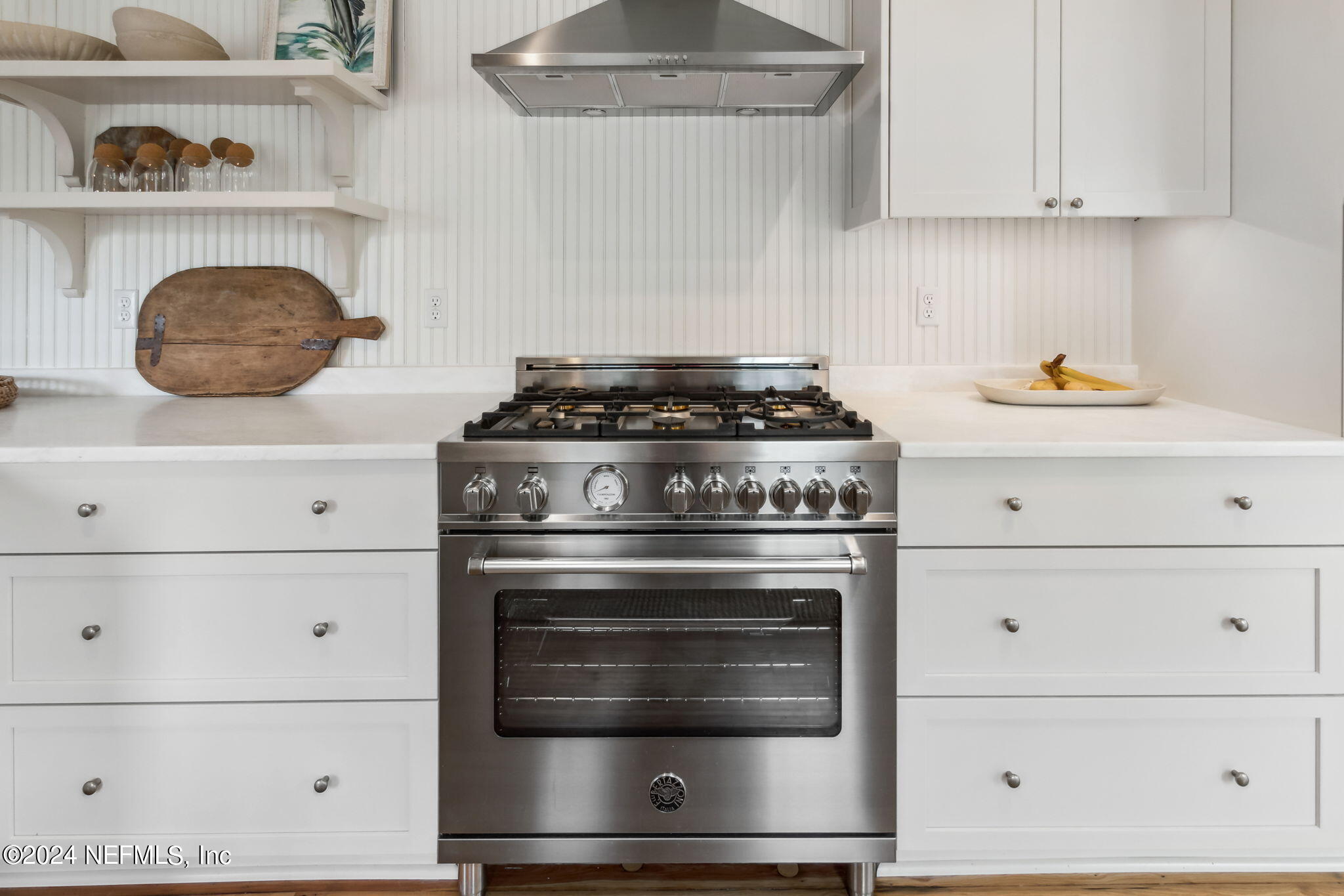 232 South 7th Street Fernandina Beach, FL 32034 - Photo 16 of 43 a stove top oven sitting inside of a kitchen and white stove
