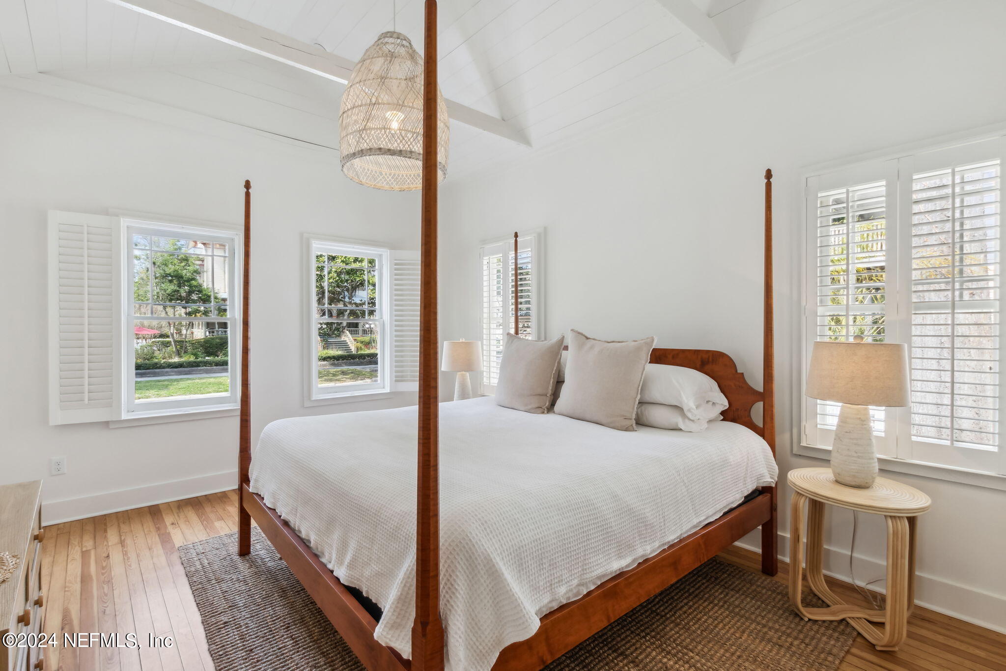 232 South 7th Street Fernandina Beach, FL 32034 - Photo 20 of 43 a large bedroom with a bed and wooden floor