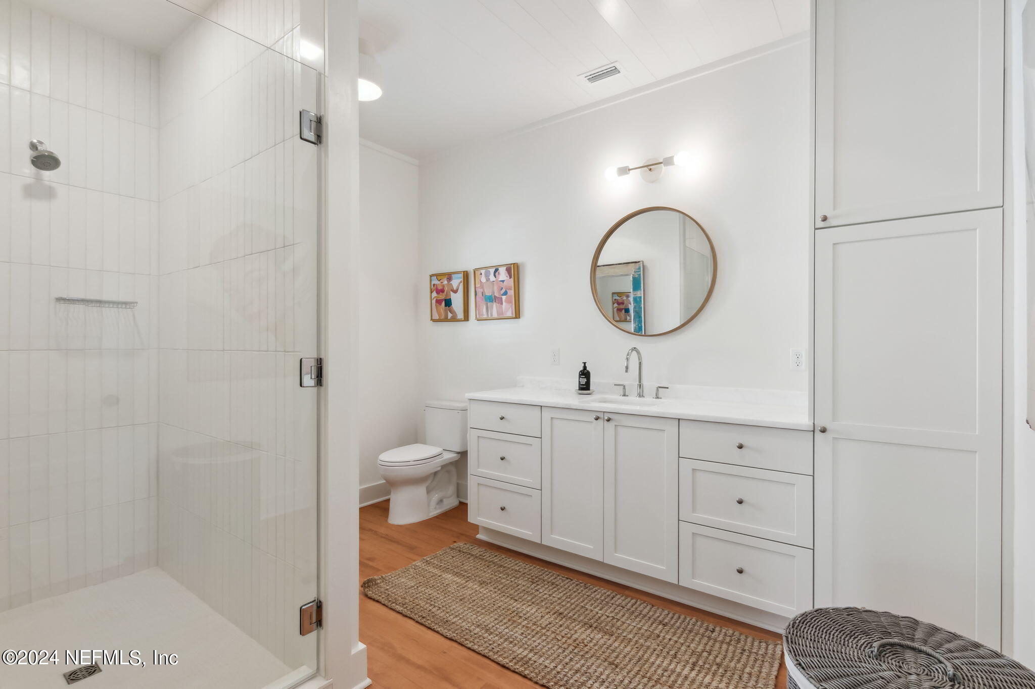 232 South 7th Street Fernandina Beach, FL 32034 - Photo 21 of 43 a bathroom with a toilet a sink and a mirror