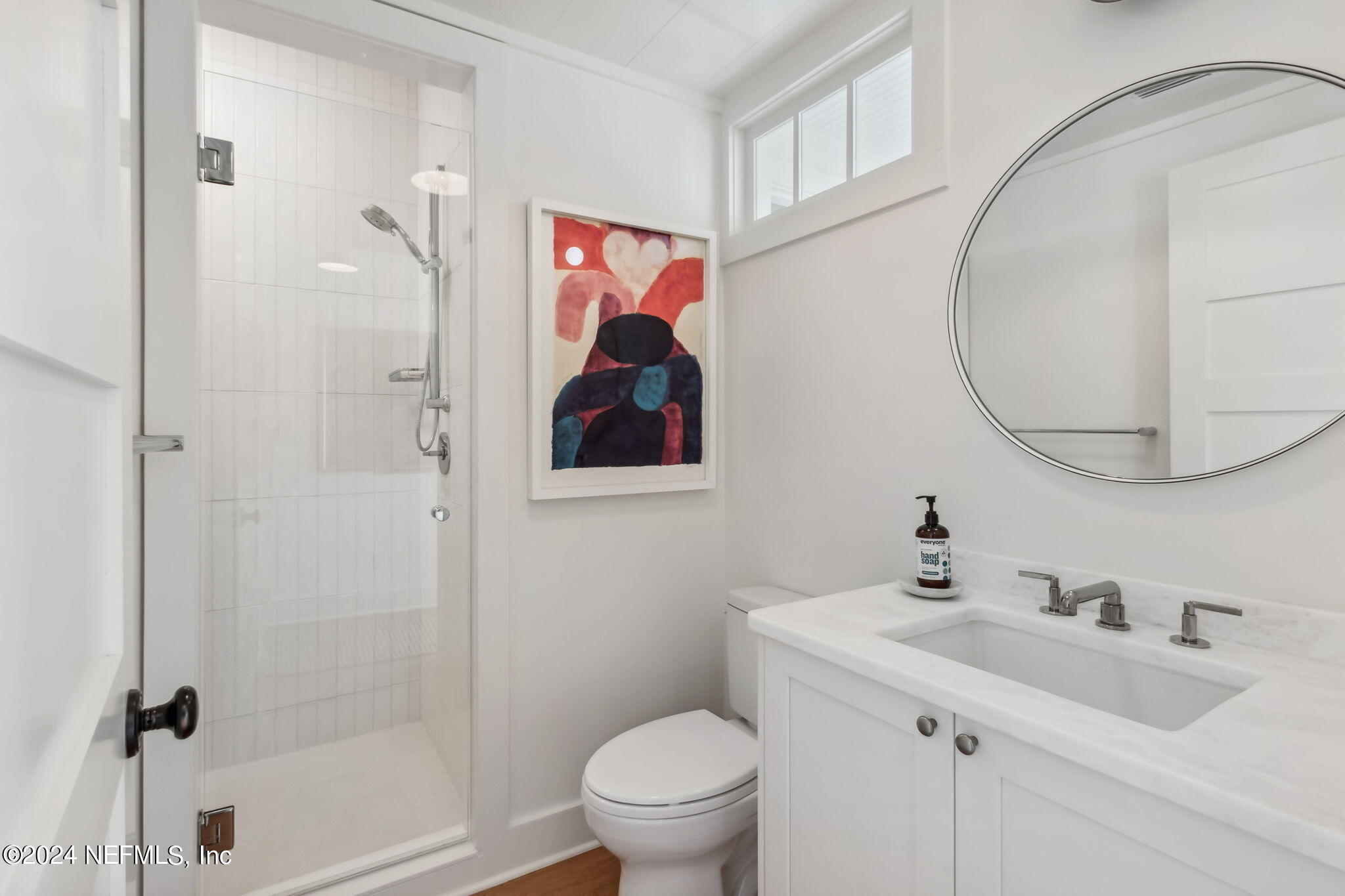 232 South 7th Street Fernandina Beach, FL 32034 - Photo 25 of 43 a bathroom with a toilet sink and mirror