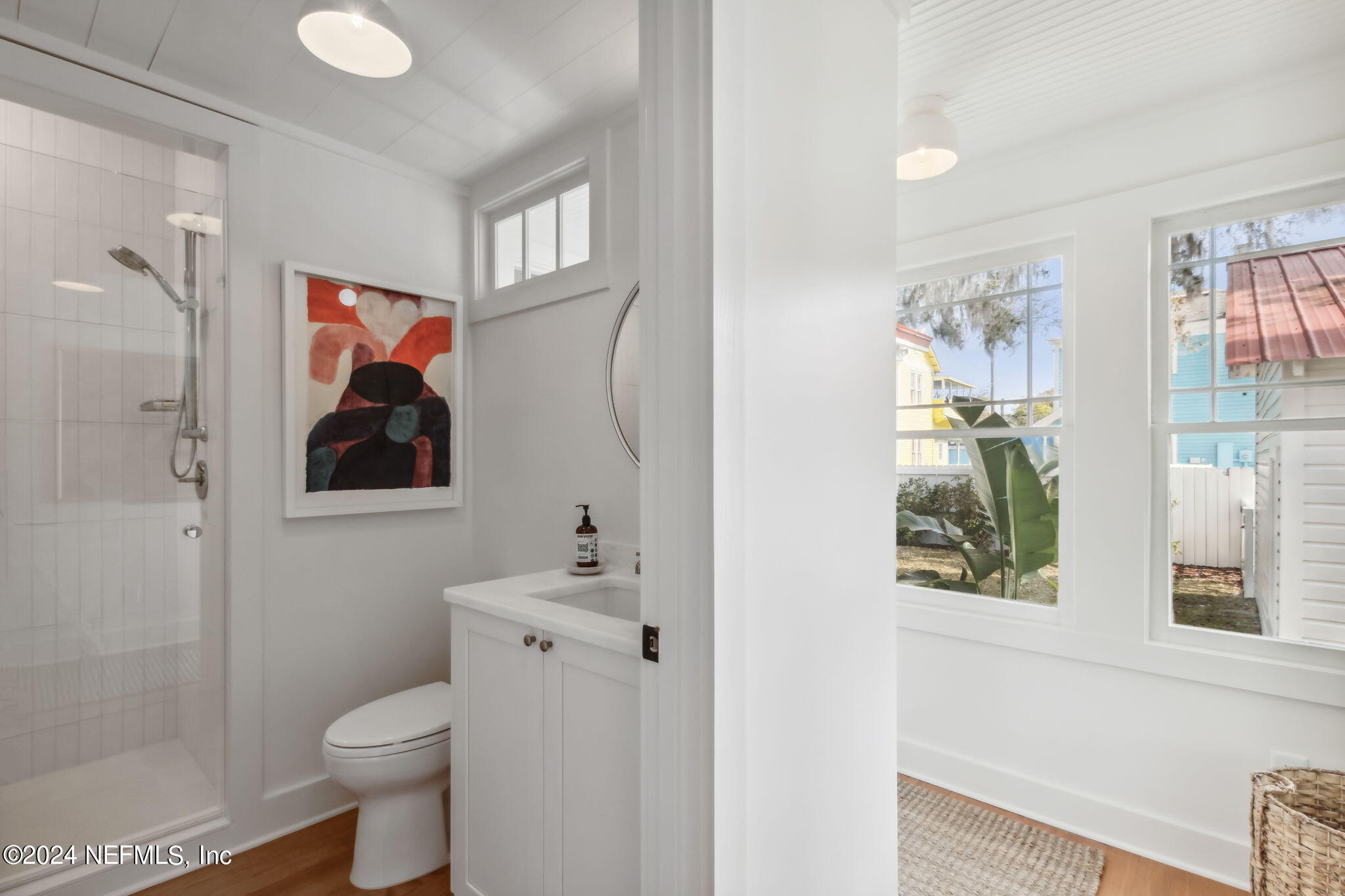 232 South 7th Street Fernandina Beach, FL 32034 - Photo 26 of 43 a bathroom with a toilet sink and mirror