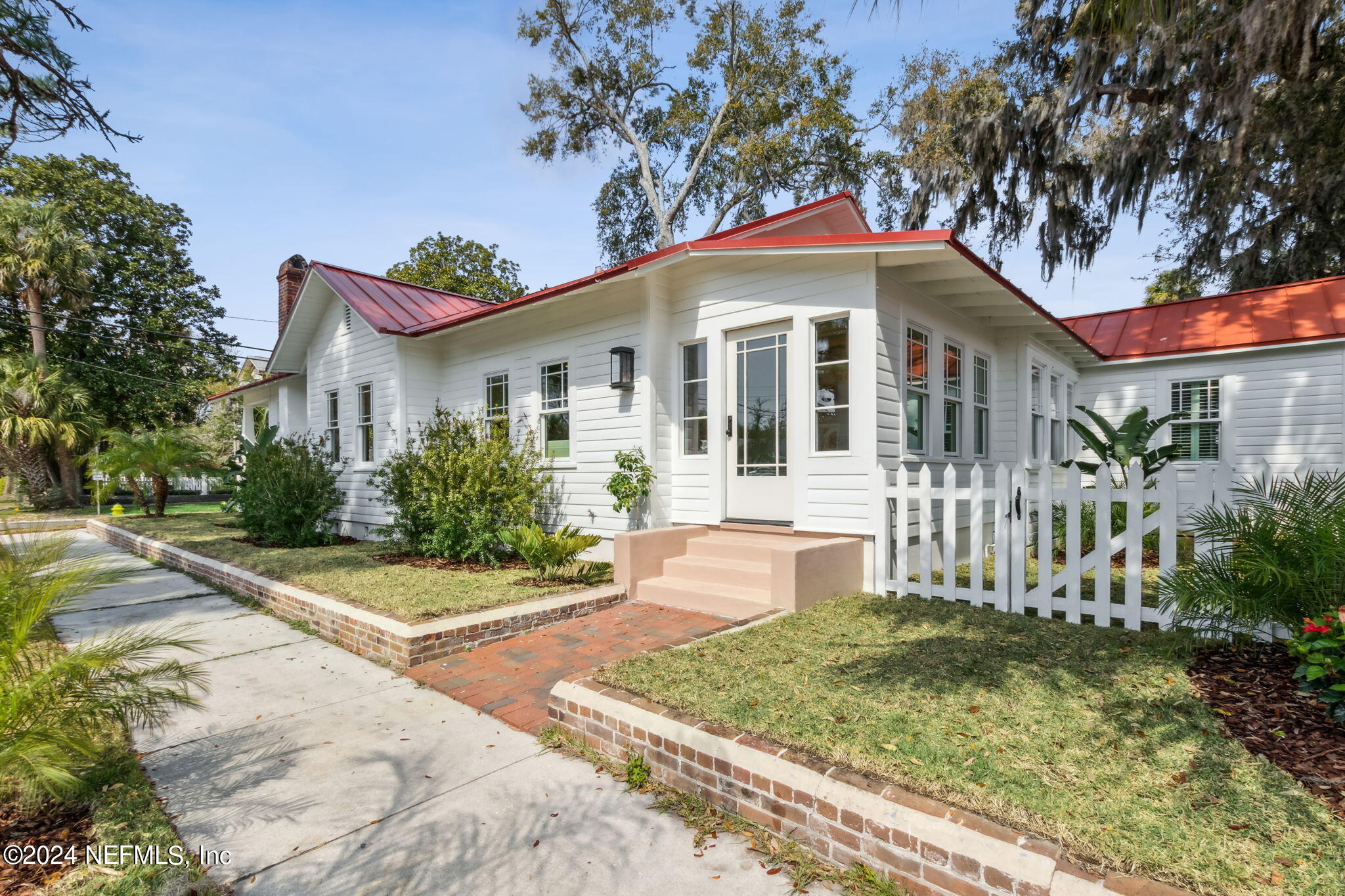 232 South 7th Street Fernandina Beach, FL 32034 - Photo 39 of 43 a front view of a house with a yard and porch