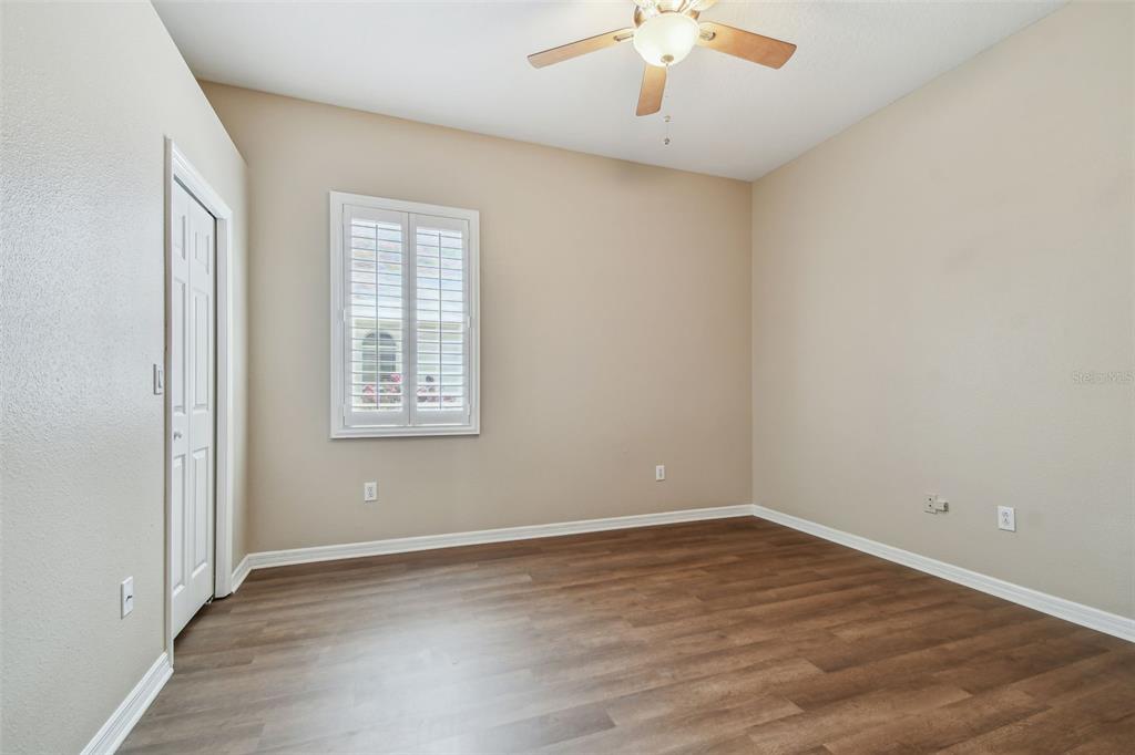 19331 Wind Dancer Street Lutz, FL 33558 - Photo 53 of 92 an empty room with wooden floor and windows