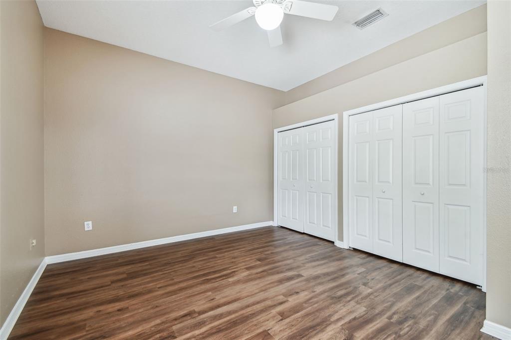 19331 Wind Dancer Street Lutz, FL 33558 - Photo 58 of 92 a view of an empty room with wooden floor