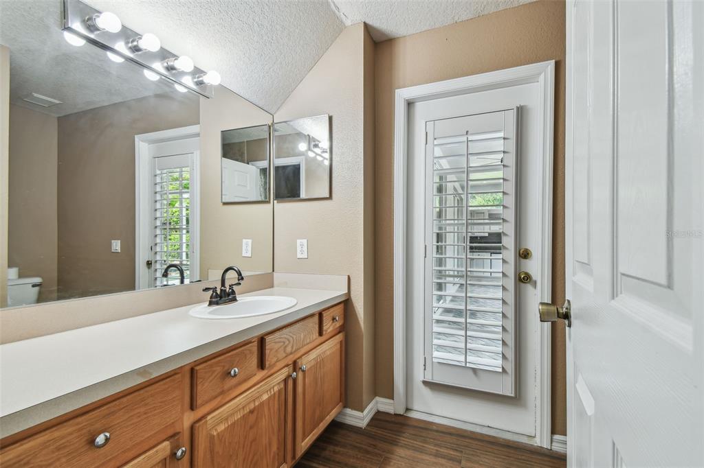 19331 Wind Dancer Street Lutz, FL 33558 - Photo 61 of 92 a bathroom with a double vanity sink a vanity and a mirror