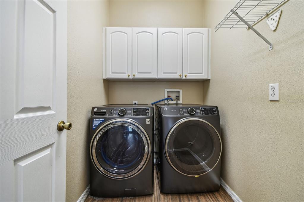 19331 Wind Dancer Street Lutz, FL 33558 - Photo 65 of 92 a view of washer and dryer in a utility room