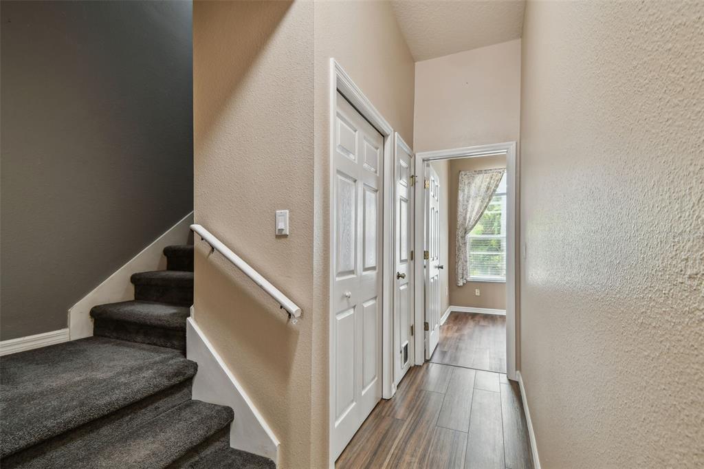 19331 Wind Dancer Street Lutz, FL 33558 - Photo 66 of 92 a view of a hallway with wooden floor and staircase