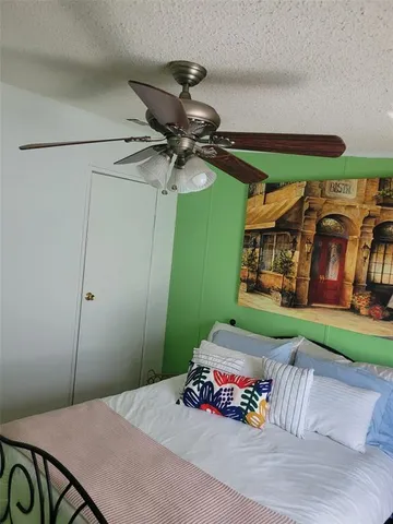 a view of a porch with table and chairs and garden