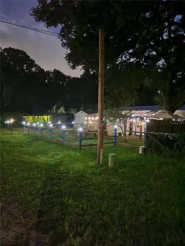 a living room with furniture and a pool table