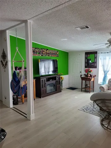 a kitchen with stainless steel appliances a sink a stove a refrigerator and cabinets