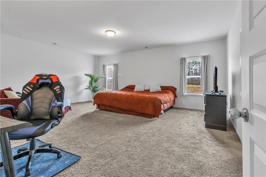 97 Crossroad Circle Jasper, GA 30143 - Photo 13 of 28 a bedroom with furniture and a bed