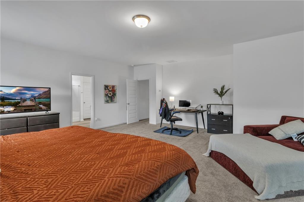 97 Crossroad Circle Jasper, GA 30143 - Photo 14 of 28 a bed room with a bed and a chair