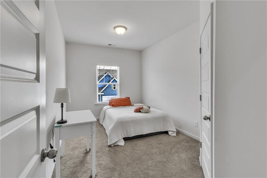 97 Crossroad Circle Jasper, GA 30143 - Photo 21 of 28 a bedroom with a bed and a window