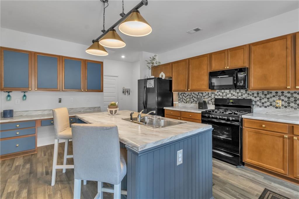97 Crossroad Circle Jasper, GA 30143 - Photo 6 of 28 a kitchen with a sink stove and refrigerator