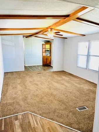a view of a room with wooden floor and cabinet