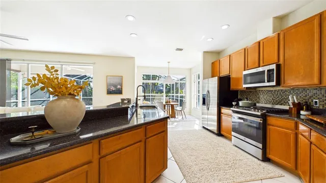 a view of living room with granite countertop furniture and a large window