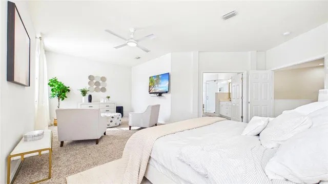 a view of walk in closet and bathroom
