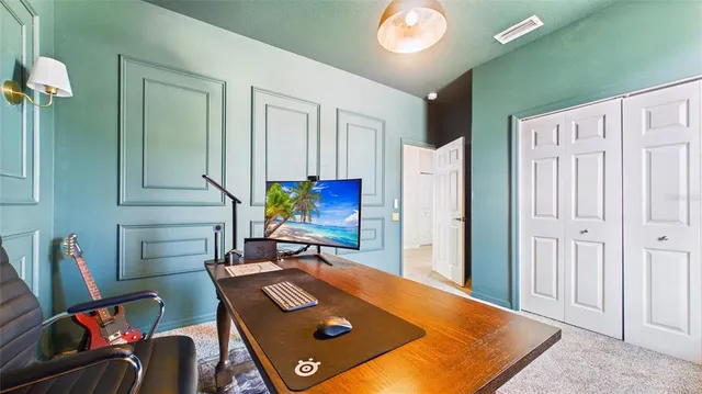 an aerial view of residential houses with outdoor space and street view